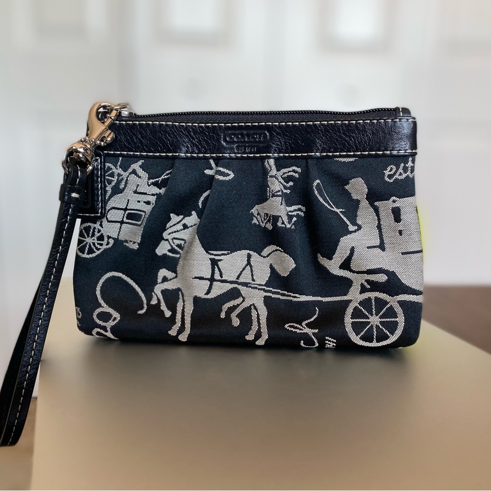 Never used / brand new - Coach wristlet with horse carriage pattern on fabric